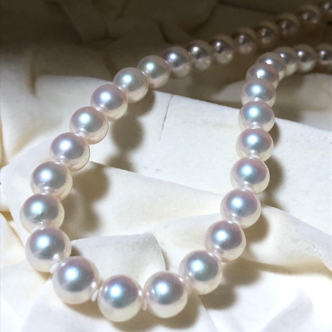 Akoya pearl necklace with 7mm white pearls and silver clasp laid flat showing length and bead size