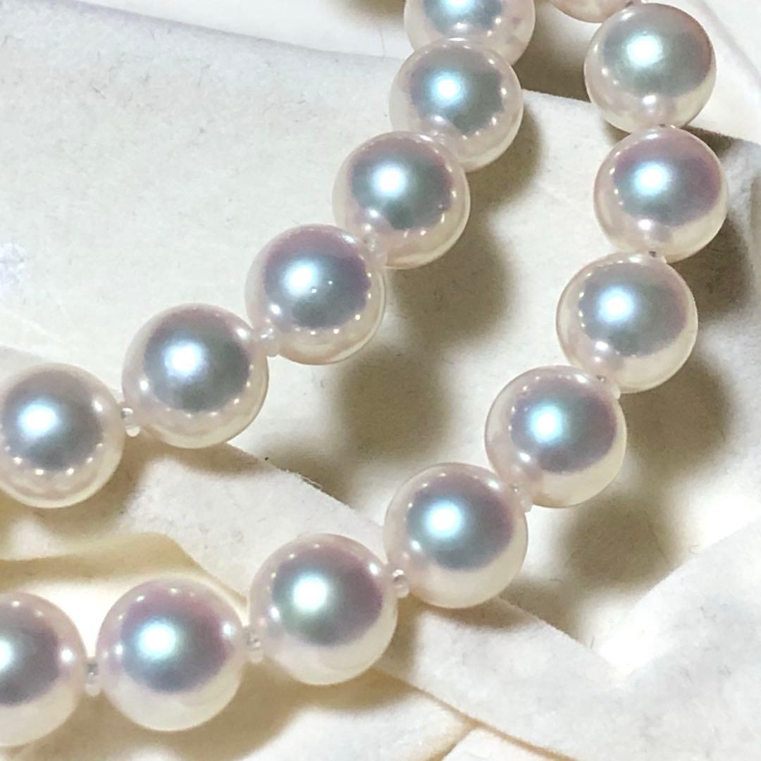 Akoya pearl necklace with 7mm white pearls and silver clasp laid flat showing length and bead size