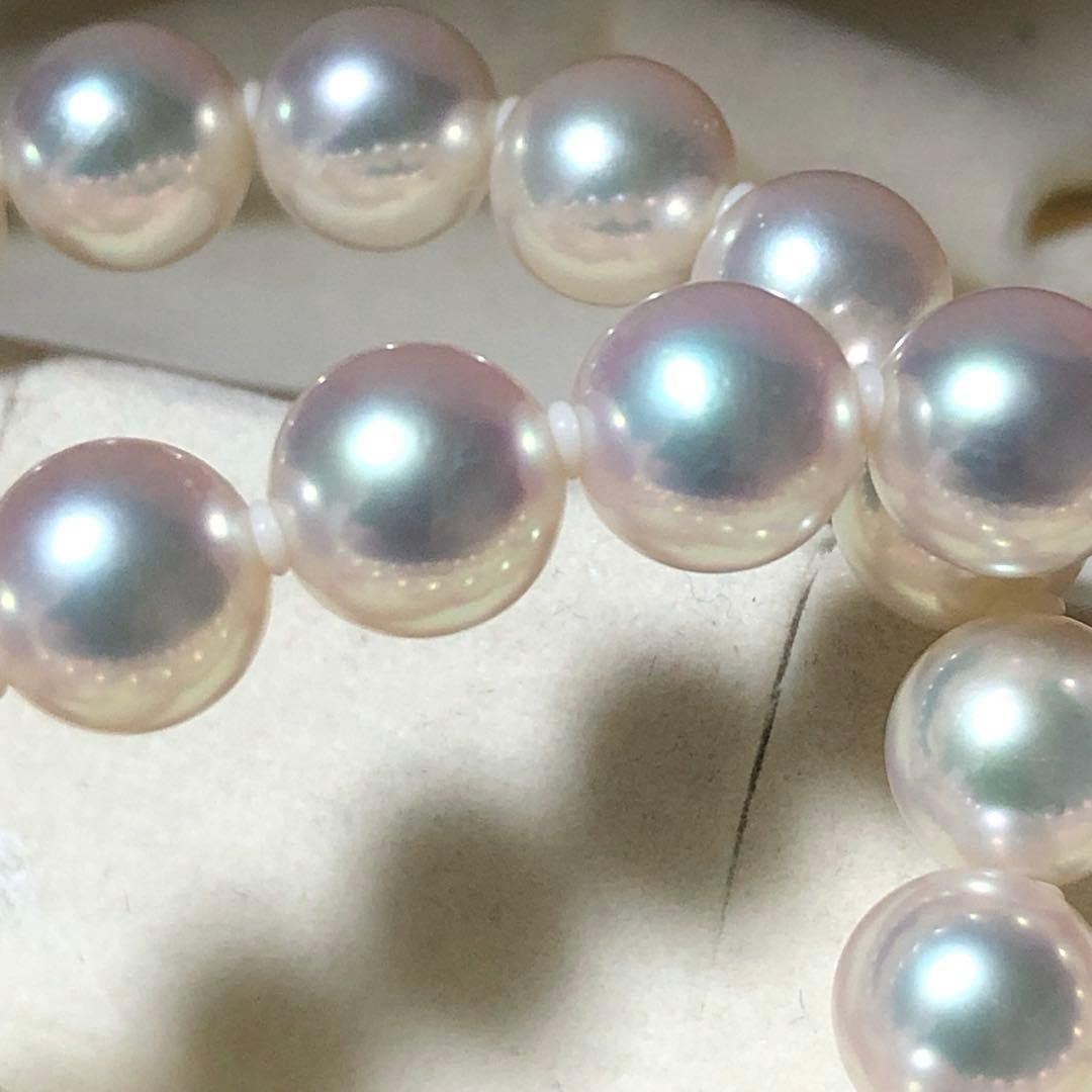 Akoya pearl necklace with 7mm white pearls and silver clasp laid flat showing length and bead size