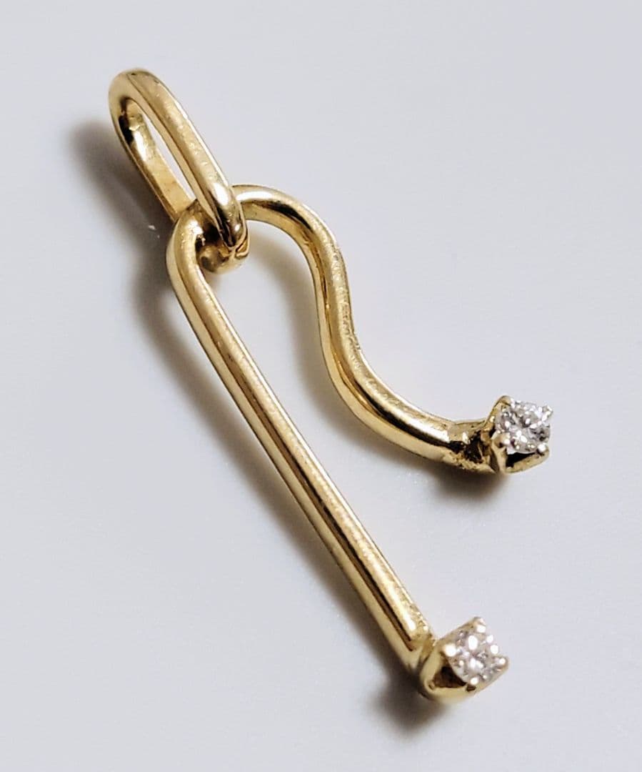 MIKIMOTO K14 yellow gold pendant top featuring 2 diamonds weighing 1.10 grams