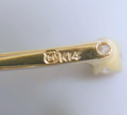 MIKIMOTO K14 yellow gold pendant top featuring 2 diamonds weighing 1.10 grams