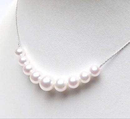 White pink round Akoya pearl necklace with 9 pearls sized 7.8 to 5.6 mm on a 46 cm Pt850 chain
