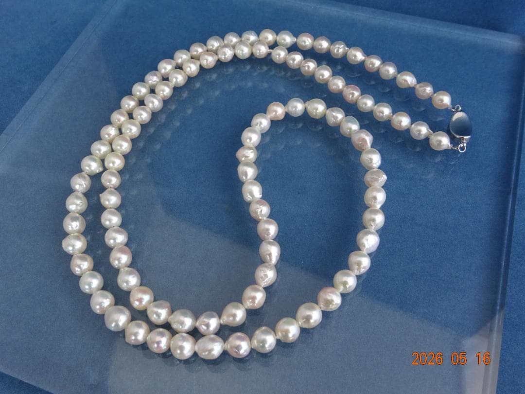 Akoya pearl necklace featuring 7-7.5mm pearls with an 83cm length displayed on a white background