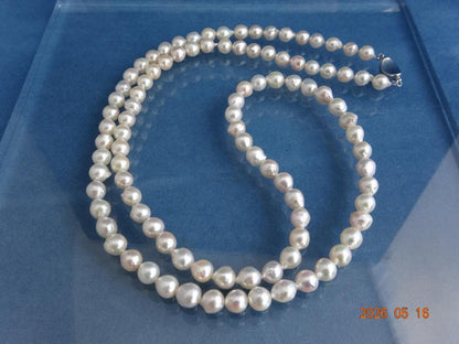 Akoya pearl necklace featuring 7-7.5mm pearls with an 83cm length displayed on a white background