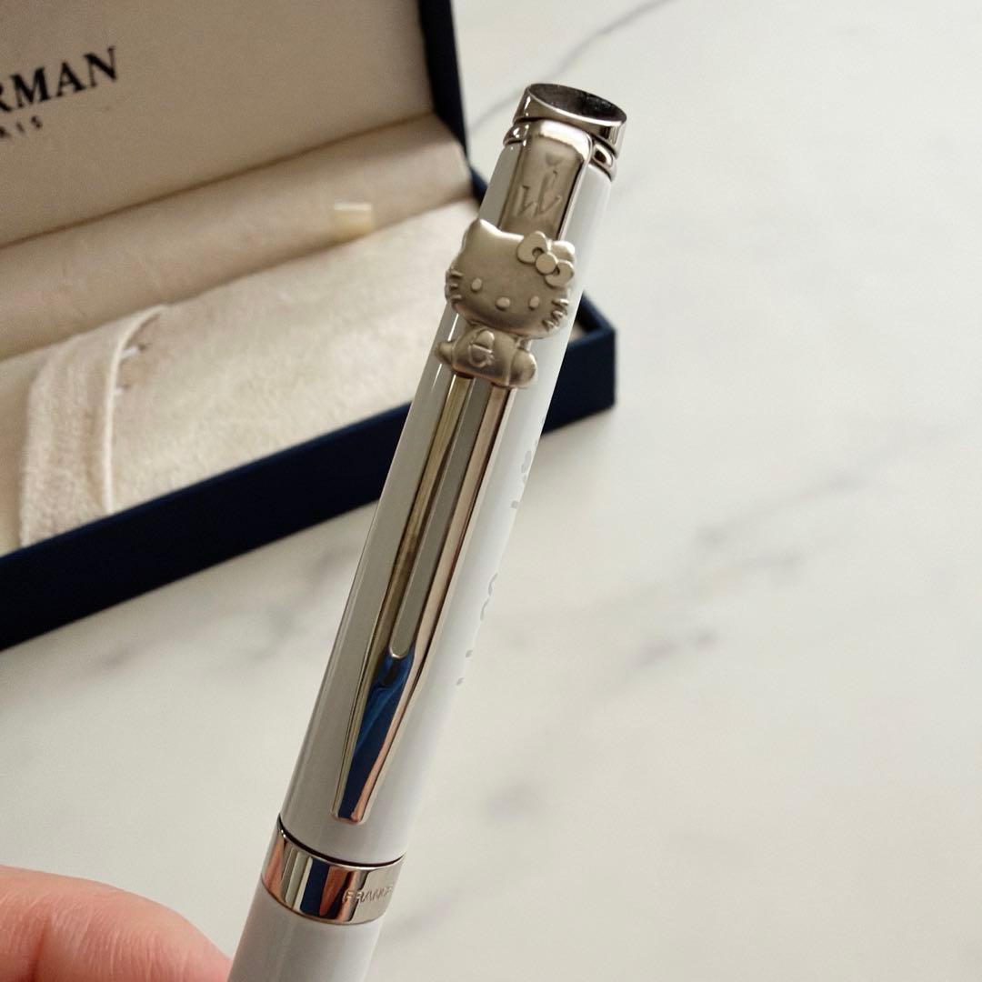 Waterman and Hello Kitty ballpoint pen with metal body and colorful design on white background