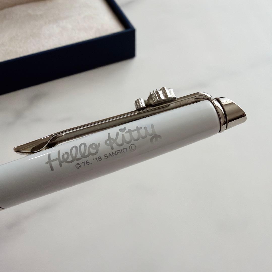 Waterman and Hello Kitty ballpoint pen with metal body and colorful design on white background