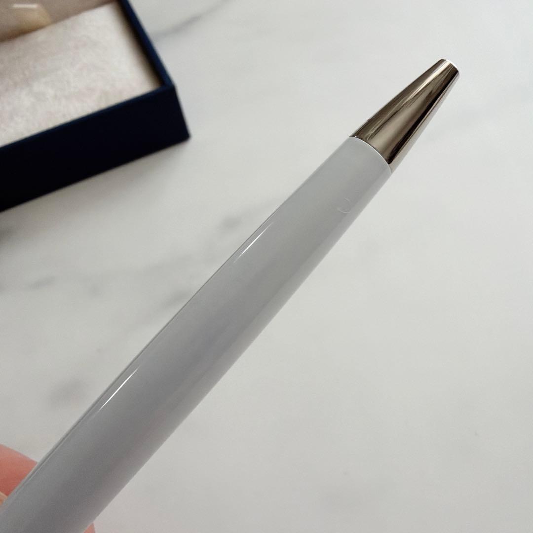 Waterman and Hello Kitty ballpoint pen with metal body and colorful design on white background