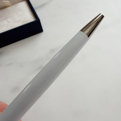 Waterman and Hello Kitty ballpoint pen with metal body and colorful design on white background