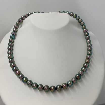 Close-up of Akoya dyed pearl necklace with 7-7.5mm pearls and silver clasp on white background