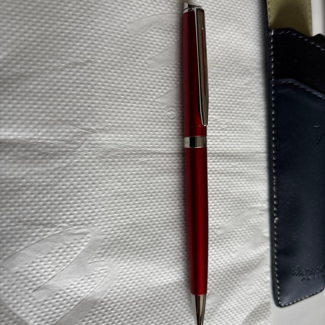 Waterman red ballpoint pen with black ink and leather case embossed with Waterman Paris logo