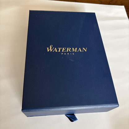 Waterman red ballpoint pen with black ink and leather case embossed with Waterman Paris logo