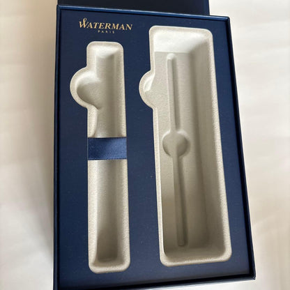 Waterman red ballpoint pen with black ink and leather case embossed with Waterman Paris logo