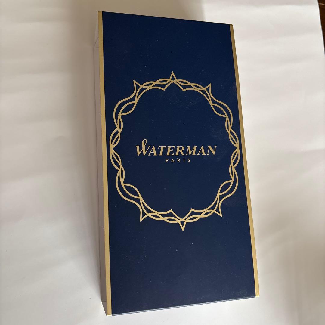 Waterman red ballpoint pen with black ink and leather case embossed with Waterman Paris logo