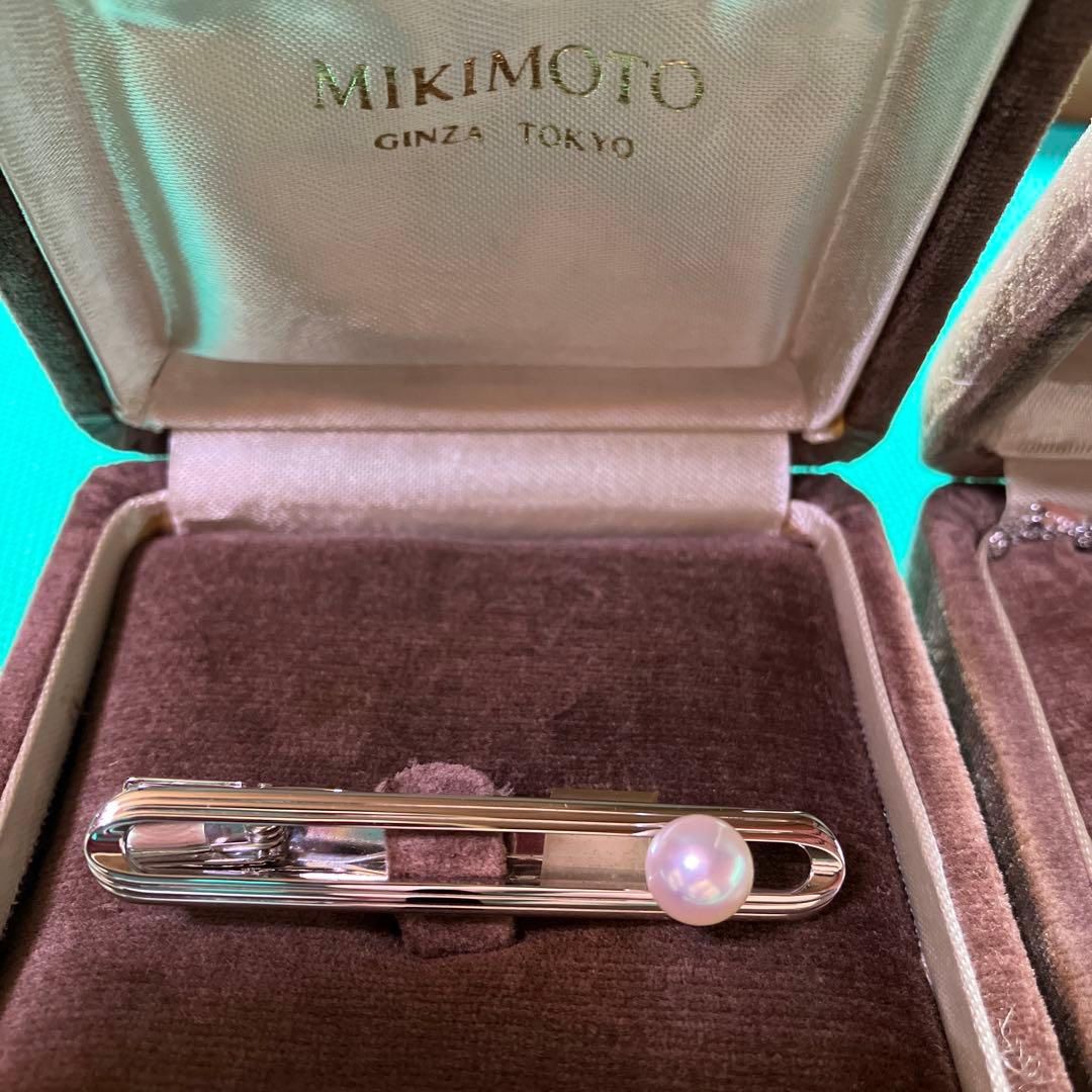 MIKIMOTO simple pearl necklace with silver chain and adjustable length shown on white background