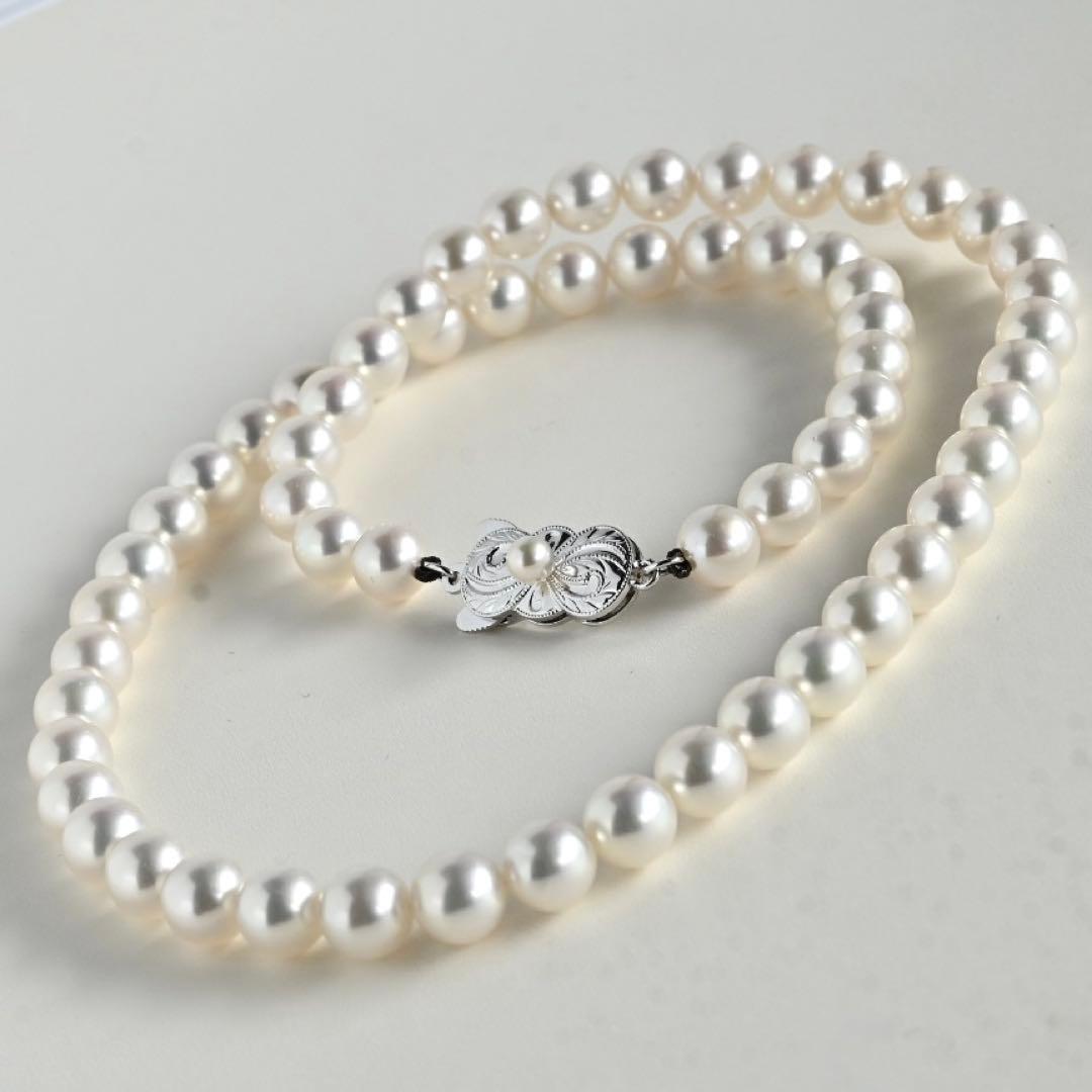 Mikimoto Akoya pearl necklace with round 7mm pearls and silver Aurora Hanadama pearl clasp