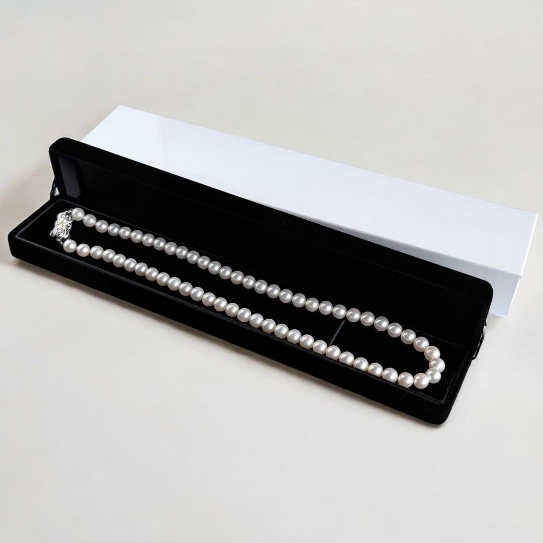 Mikimoto Akoya pearl necklace with round 7mm pearls and silver Aurora Hanadama pearl clasp