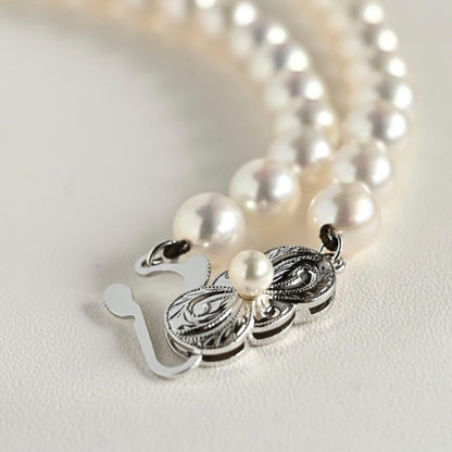 Mikimoto Akoya pearl necklace with round 7mm pearls and silver Aurora Hanadama pearl clasp