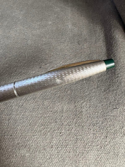 Pilot 14k 585 fountain pen with silver grid pattern body and green accents showing slight dent