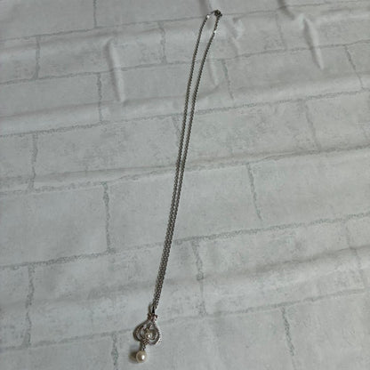 Mikimoto necklace featuring a large 0.8 cm Akoya pearl with silver motif and 59 cm silver chain