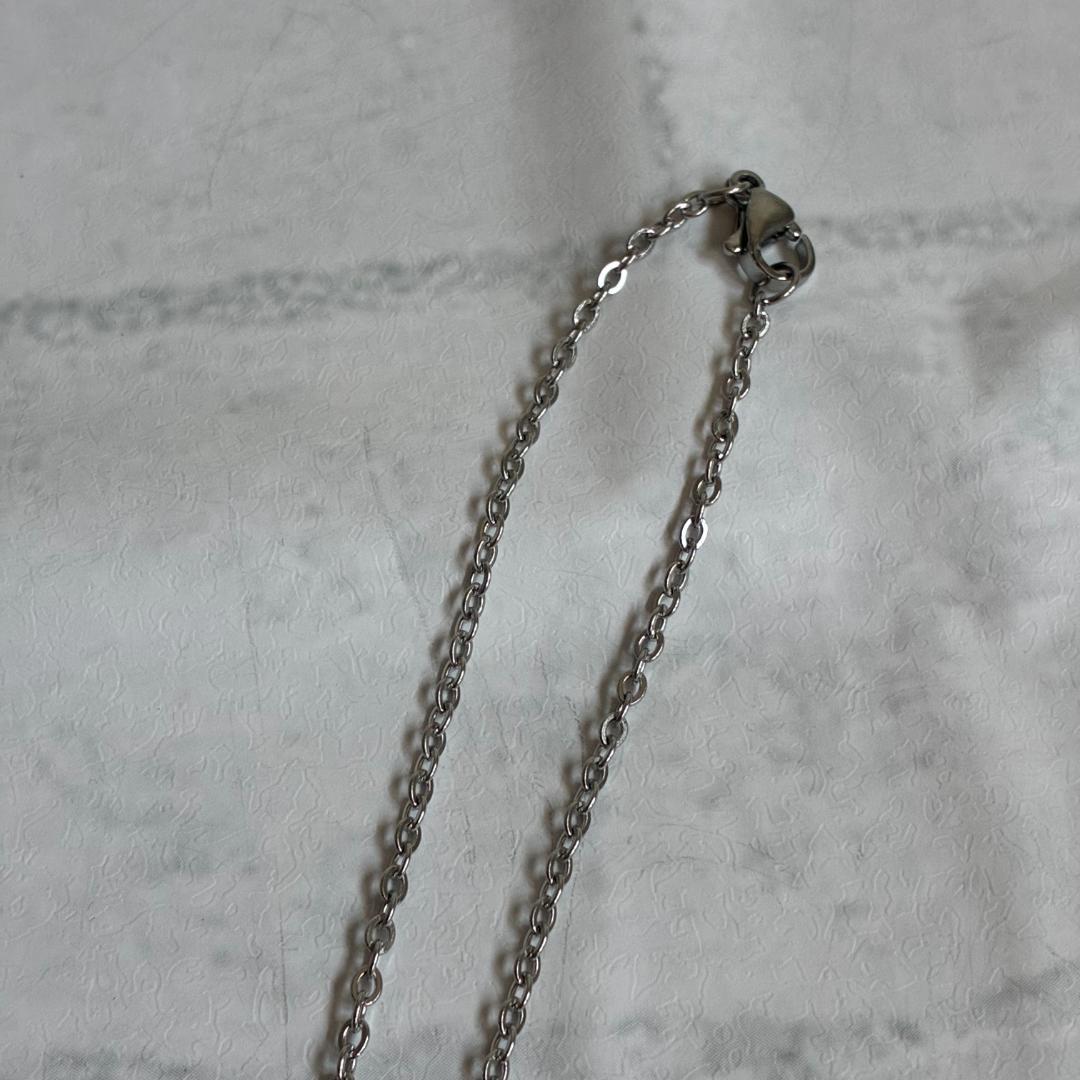 Mikimoto necklace featuring a large 0.8 cm Akoya pearl with silver motif and 59 cm silver chain