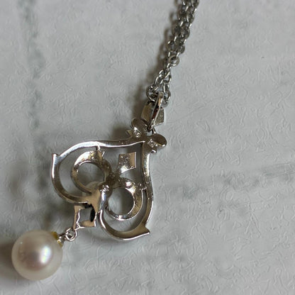 Mikimoto necklace featuring a large 0.8 cm Akoya pearl with silver motif and 59 cm silver chain