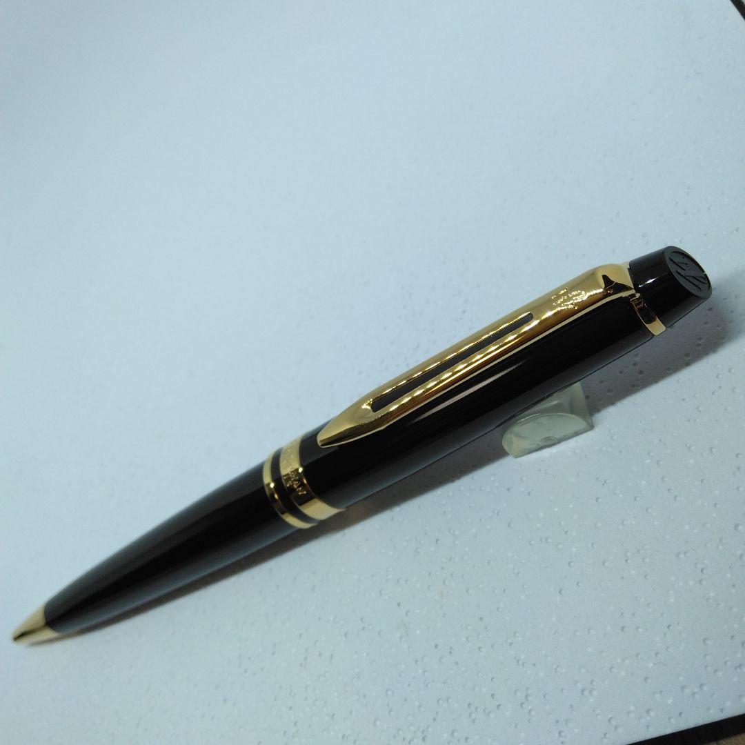 Waterman Expert Black GTBP ballpoint pen with metal black body and gold accents shown with dedicated case