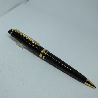 Waterman Expert Black GTBP ballpoint pen with metal black body and gold accents shown with dedicated case