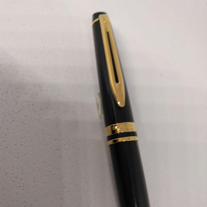 Waterman Expert Black GTBP ballpoint pen with metal black body and gold accents shown with dedicated case