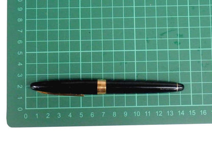 Pilot fountain pen with 18K gold nib and black metal body, decorated with gold accents