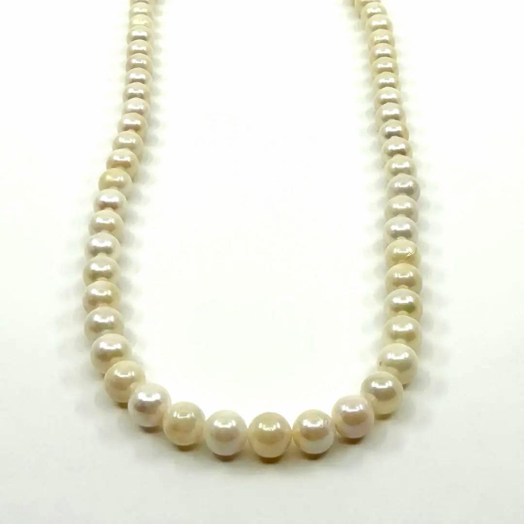 Akoya real pearl necklace with 6.4-6.8mm white pearls and silver clasp on a white background