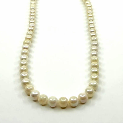 Akoya real pearl necklace with 6.4-6.8mm white pearls and silver clasp on a white background