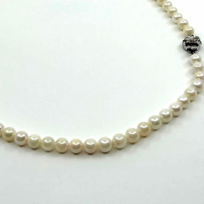 Akoya real pearl necklace with 6.4-6.8mm white pearls and silver clasp on a white background