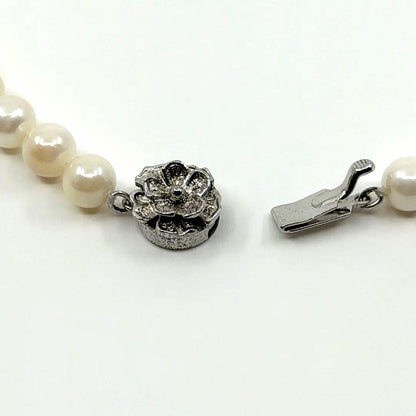 Akoya real pearl necklace with 6.4-6.8mm white pearls and silver clasp on a white background