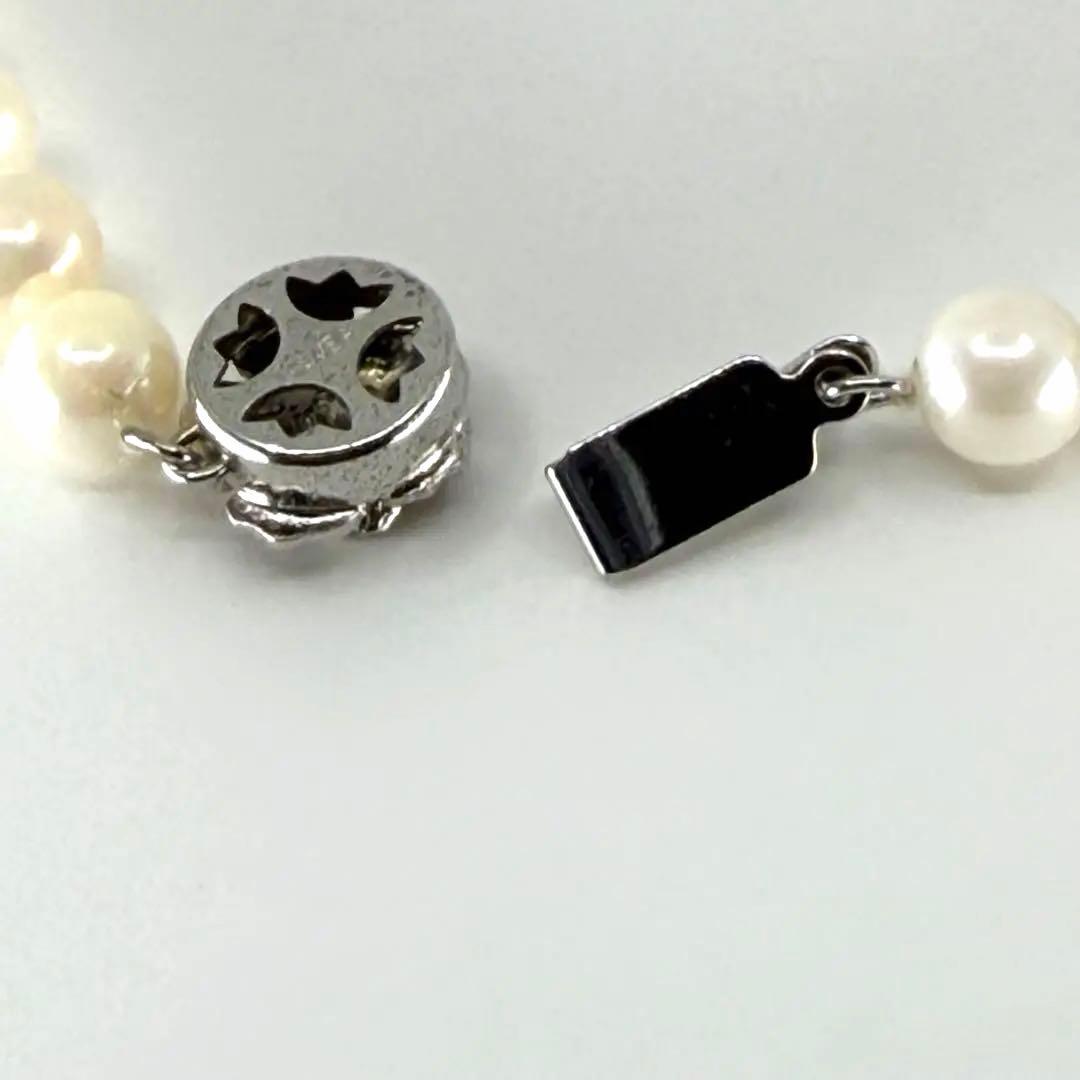 Akoya real pearl necklace with 6.4-6.8mm white pearls and silver clasp on a white background