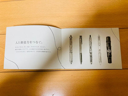 Five-piece set of Pilot pens including leaflet for each writing instrument on a white background