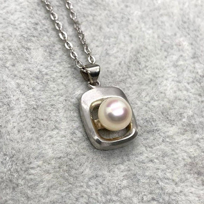 Akoya pearl necklace with 6.3mm white pearls and silver mark pendant on 41cm chain