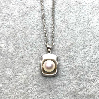 Akoya pearl necklace with 6.3mm white pearls and silver mark pendant on 41cm chain