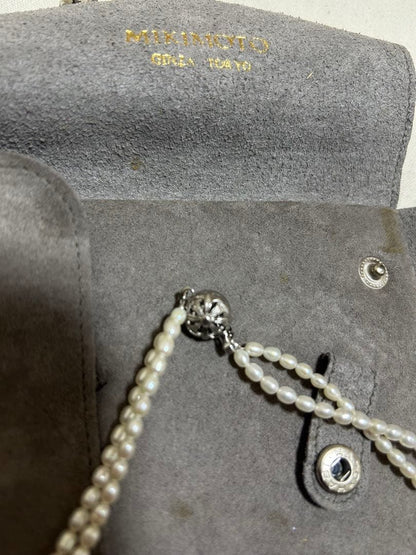 MIKIMOTO Baby Pearl Necklace with white freshwater pearls in new condition displayed with aged case
