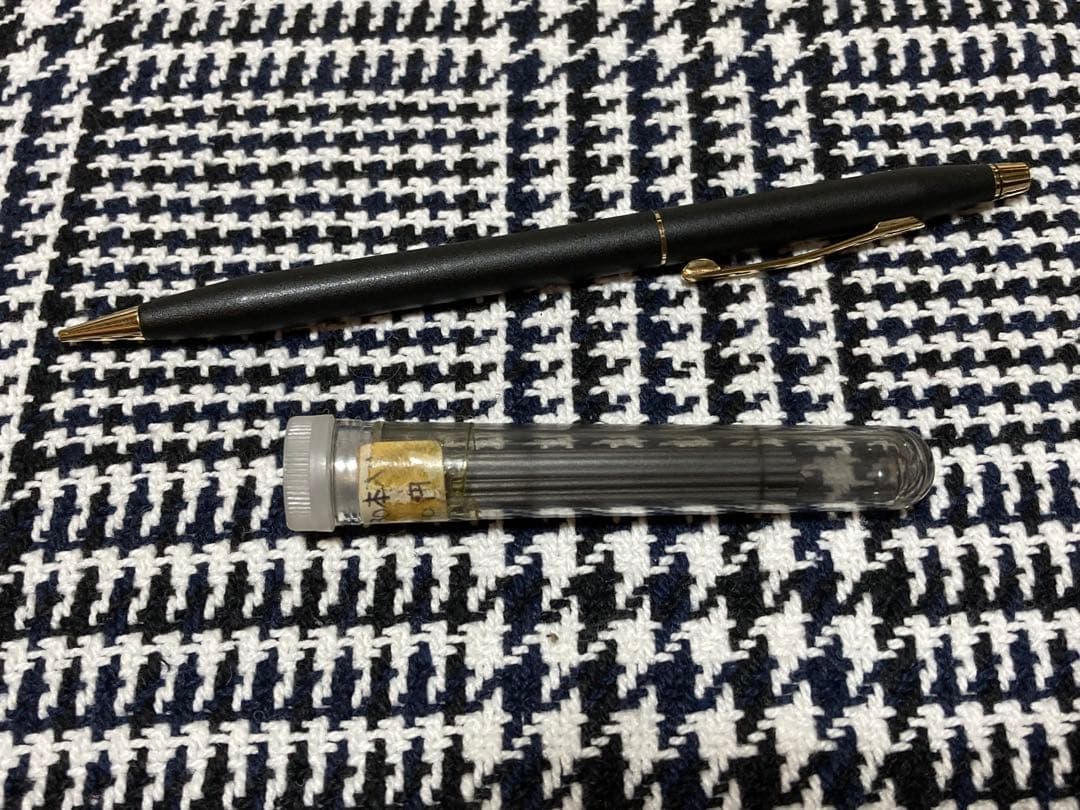 Cross mechanical pencil with wine-colored pen holder and 23 lead refills displayed