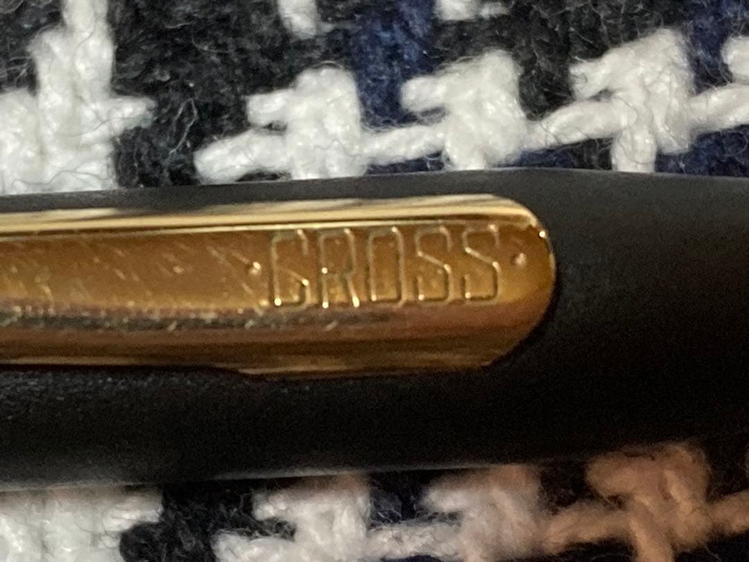 Cross mechanical pencil with wine-colored pen holder and 23 lead refills displayed