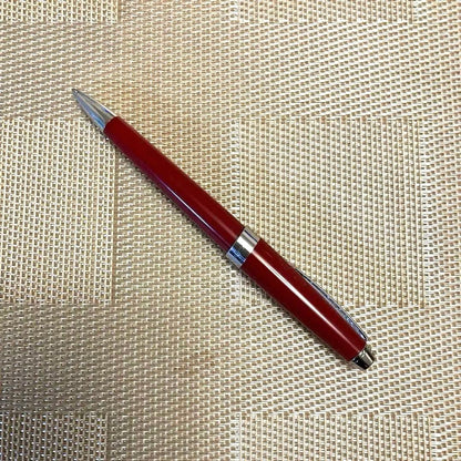 Cross ballpoint pen twist type in shiny Aventurared body, 57mm length, shown on white background