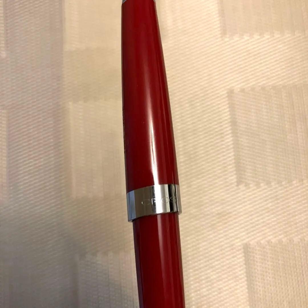 Cross ballpoint pen twist type in shiny Aventurared body, 57mm length, shown on white background