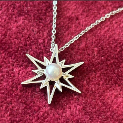 Mikimoto Star Necklace with a pearl pendant and star design on a silver chain