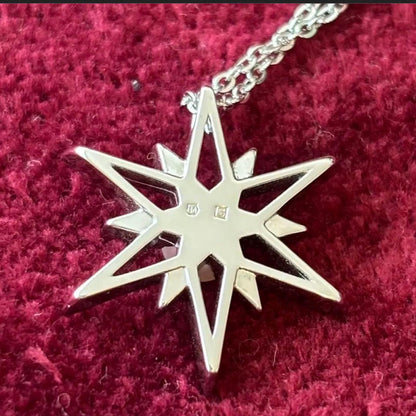 Mikimoto Star Necklace with a pearl pendant and star design on a silver chain