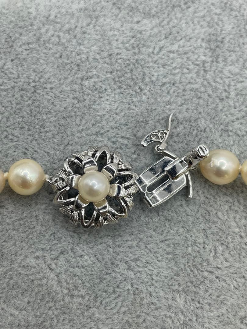 Long Akoya pearl necklace with 7mm genuine pearls on a silver chain measuring 80 cm