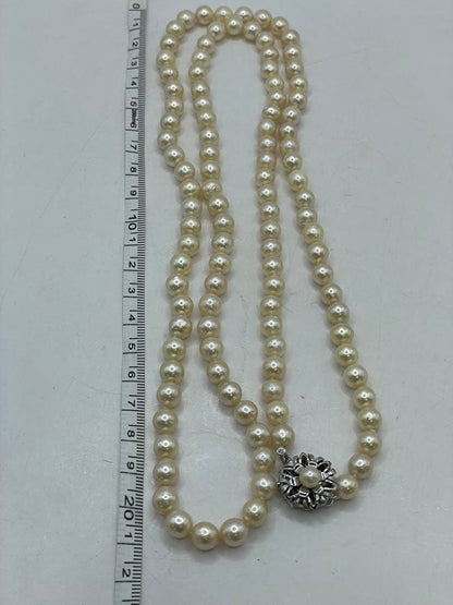 Long Akoya pearl necklace with 7mm genuine pearls on a silver chain measuring 80 cm
