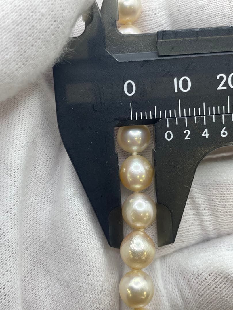 Long Akoya pearl necklace with 7mm genuine pearls on a silver chain measuring 80 cm