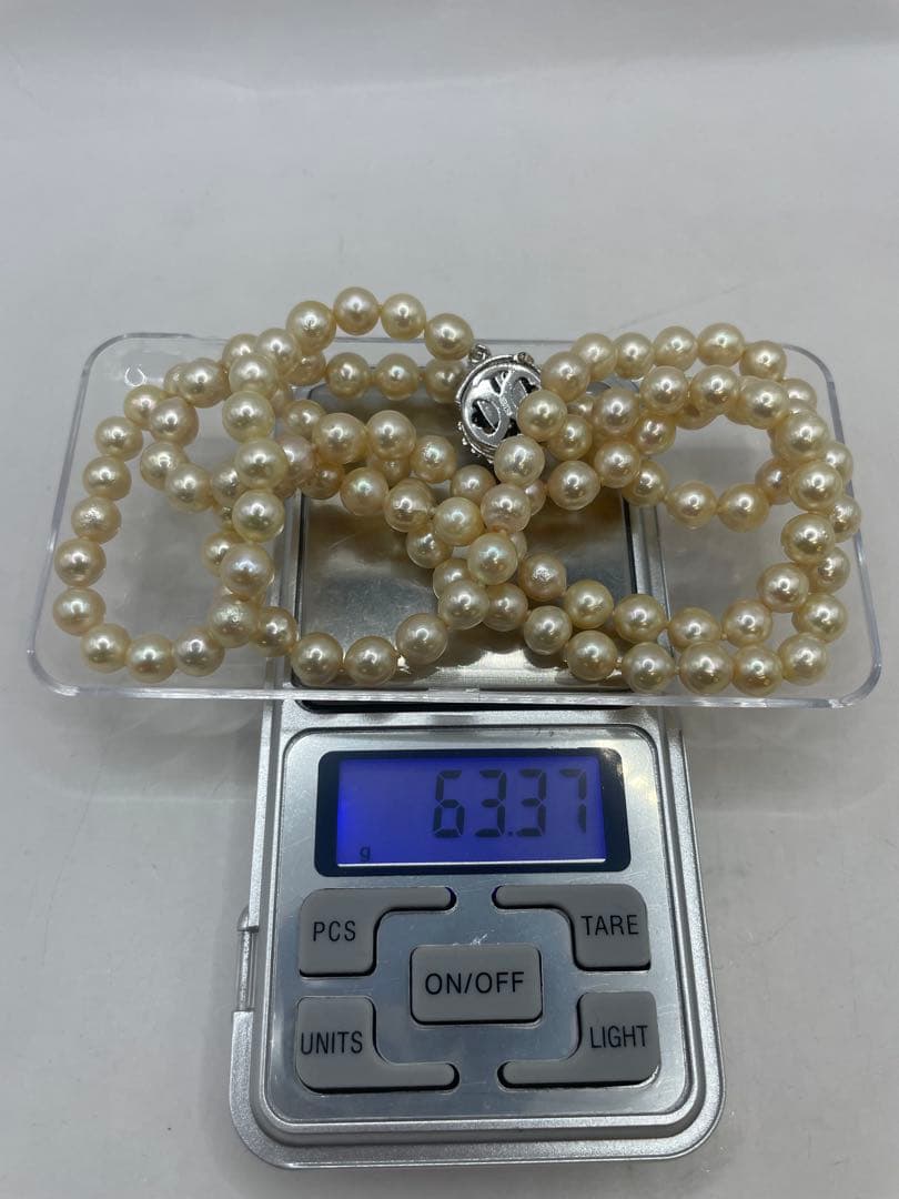 Long Akoya pearl necklace with 7mm genuine pearls on a silver chain measuring 80 cm