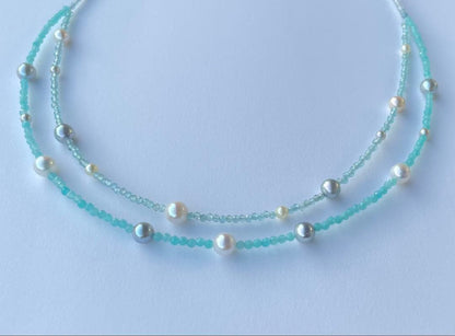 Akoya pearl layered necklace with 19 pearls in sea and sky colors showcasing transparency and unique design