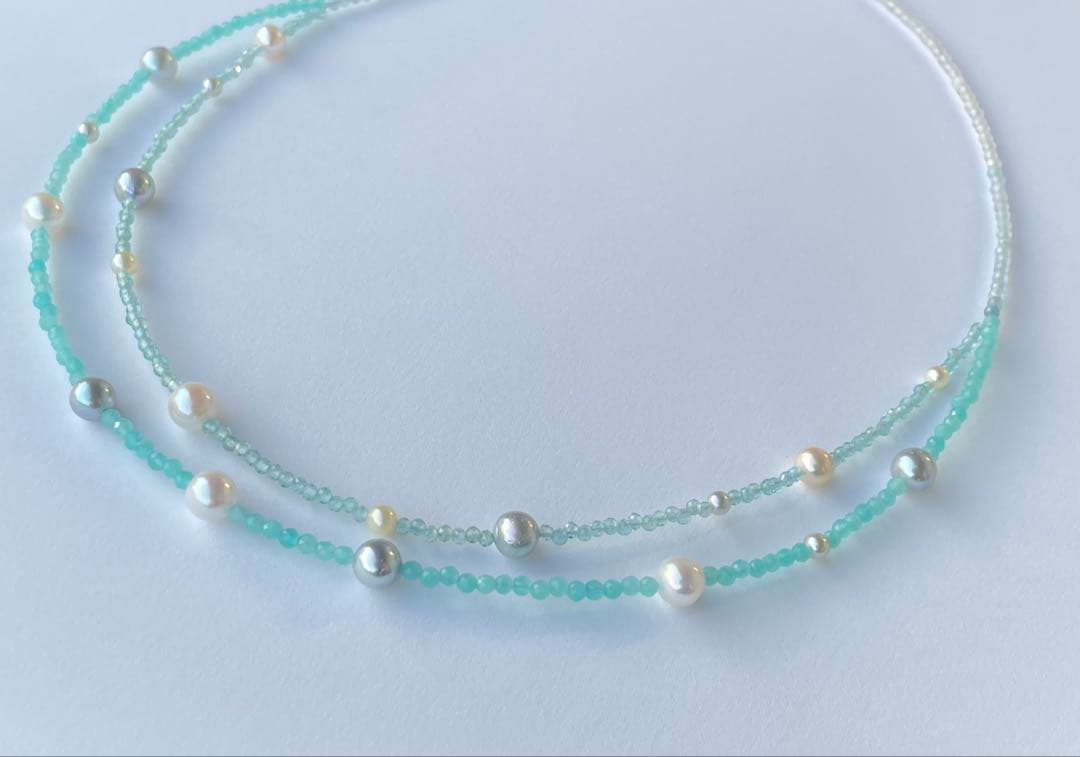 Akoya pearl layered necklace with 19 pearls in sea and sky colors showcasing transparency and unique design